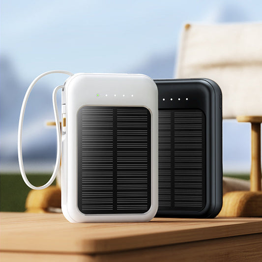 Compacte powerbank met zonnepaneel en kabels – productafbeelding