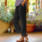 Casual, effen, ruimvallende cropped broek met knopen aan de zijkan