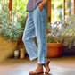 Casual, effen, ruimvallende cropped broek met knopen aan de zijkan