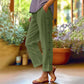 Casual, effen, ruimvallende cropped broek met knopen aan de zijkan