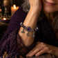 🔮 Paarse Halloween-armband met heksenbedeltjes